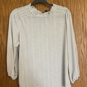 White and black polka dot blouse